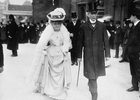 Original title:  Sir Wilfrid and Lady Laurier going to the Parliamentary luncheon, Colonial Conference. Hon. L.P. Brodeur in the background. 