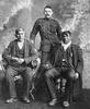 Original title:  L-R: unknown; Sergeant K. J. Anderson; Moostoos [Mostos], Cree chief. Date: c. 1904. Image courtesy of Glenbow Museum, Calgary, Alberta.