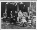 Original title:  Group portrait of Dr. Richard Maurice Bucke with family members and young friend, on the steps of the Medical Superintendent's house, London Asylum, London, Ontario. Ivey Family London Room, London Public Library, London, Ontario, Canada.