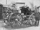 Titre original&nbsp;:  Hamilton Herald, August 1, 1929. Caption:"The Late Fire Chief A. W. Aitchison / With skeleton chemical wagon, which was wrecked at the corner of Barton and Hughson streets in collision with a street car. This piece of apparatus was, in its day, the pride of the department."
Alexander William Aitchison was the Fire Chief from January 14, 1879 to his death on August 5, 1905, on the way to a fire when his rig collided with a chemical engine at the base of the statue of Sir John A. Macdonald, at the corner of King and John Streets.

Photo Credit - Hamilton Public Library Archives.