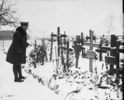 Original title:  Gen. Currie visits Cemetery in Andenne where 200 civilians were shot by Germans against a wall, 21st August 1918. 