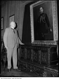 Original title:  Sir Henry Pellatt views his own portrait at Casa Loma. [ca. 1930]. City of Toronto Archives, Fonds 1244, Item 4014, William James family fonds.